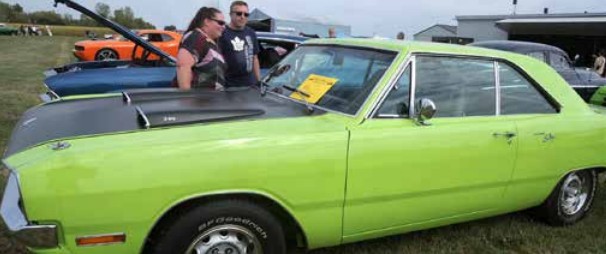Jody and Keith Farkas check out a 1970 Dodge Dart, owned by Ron and Irene Dalby of Tillsonburg, at the Canadian Harvard Aircraft Association’s annual Wings & Wheels Family Fun Day at the Tillsonburg Regional Airport on Sept. 13.