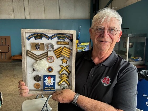 Darrell G. Ball shared memorabilia from his career in the Canadian military at the annual Wings and Wheels Family Fund Day at the Tillsonburg Regional Airport on Saturday. The event is held by the Canadian Harvard Aircraft Association attracts hundreds of classic cars and more than 3,000 people. Photo by Vincent Ball /Vincent Ball/The Expositor