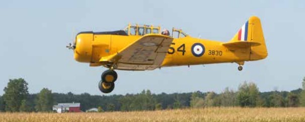 A Harvard plane takes off Saturday at the Tillsonburg Regional Airport during the annual Wings & Wheels Family Fun Day.