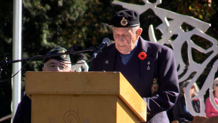 Padre Frank Mantz speaks to the hundreds of people in attendance at the dedication ceremony of the Byron Springbank Veterans Monument on Oct. 3, 2026 (Brent Lale/CTV News London)