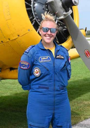 Pilot Jamie MacDonald stands in front of the Harvard she was flying during Wings and Wheels. The newest addition to the Canadian Harvard Aircraft Association’s pilot ranks, she flew for Buffalo Airways in the Northwest Territories before joining Air Canada. (Jeff Helsdon Photo)
