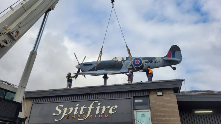 A Second World War Spitfire replica has been removed from a Kitchener rooftop and donated to an aviation group for a new military memorial garden.