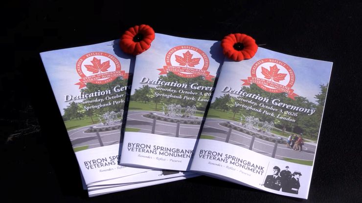 Dedication ceremony programs at the unveiling ceremony of the Byron Springbank Veterans Monument on Oct. 3, 2026. (Brent Lale/CTV News London)