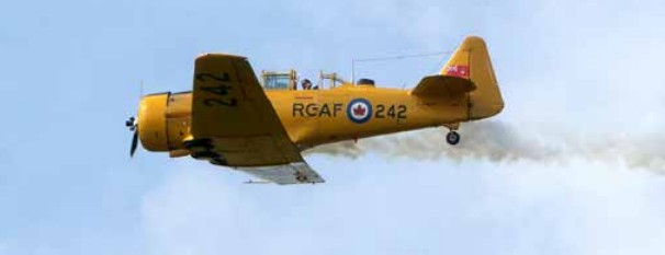 A Harvard plane takes off Saturday at the Tillsonburg Regional Airport during the annual Wings & Wheels Family Fun Day.