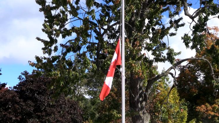 Flag at half-mast at the unveiling ceremony of the Byron Springbank Veterans Monument on Oct. 3, 2026. (Brent Lale/CTV News London)