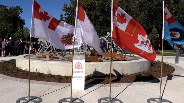 Flags at the unveiling ceremony of the Byron Springbank Veterans Monument on Oct. 3, 2026. (Brent Lale/CTV News London)