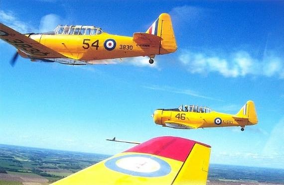 Flying WWII Harvard Aircrafts of the Canadian Harvard Aircraft Association. Photo Courtesy of Tourism Oxford.