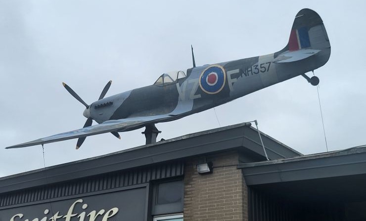 Replica WWII Spitfire perched atop the K-W Surplus was removed on April 20, 2026 and is being donated to the Tillsonburg Regional Airport.