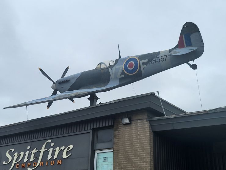 Replica WWII Spitfire perched atop the K-W Surplus was removed on April 20, 2026 and is being donated to the Tillsonburg Regional Airport.