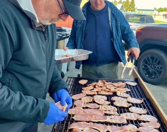 Craig Wesson, left, and Ed Das, members of the Perth County Flying Club, cooked several pounds of peameal bacon on Sunday for the annual Stratford Airport Family Pancake Breakfast. More than 700 guests — a record — had breakfast at the event, which has been held for more than a decade. Money raised supports the Stratford General Hospital Foundation, though it will take a few days to calculate the final tally.