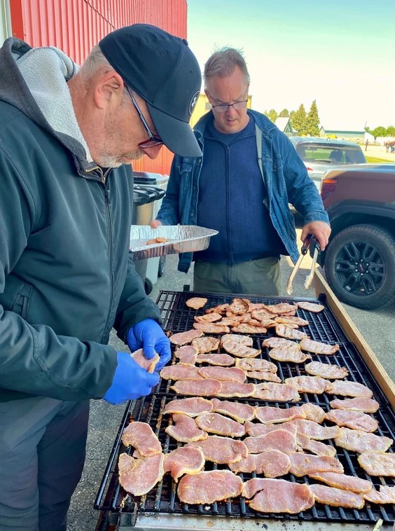 Craig Wesson, left, and Ed Das, members of the Perth County Flying Club, cooked several pounds of peameal bacon on Sunday for the annual Stratford Airport Family Pancake Breakfast. More than 700 guests — a record — had breakfast at the event, which has been held for more than a decade. Money raised supports the Stratford General Hospital Foundation, though it will take a few days to calculate the final tally.
