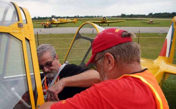 Although there was a fee for the public to fly in a Harvard, opportunities to sit in the cockpit were at no charge. Dozens of people capitalized on this, sitting in the back seat to look at the controls and radio headsets. (JEFF HELSDON PHOTO)